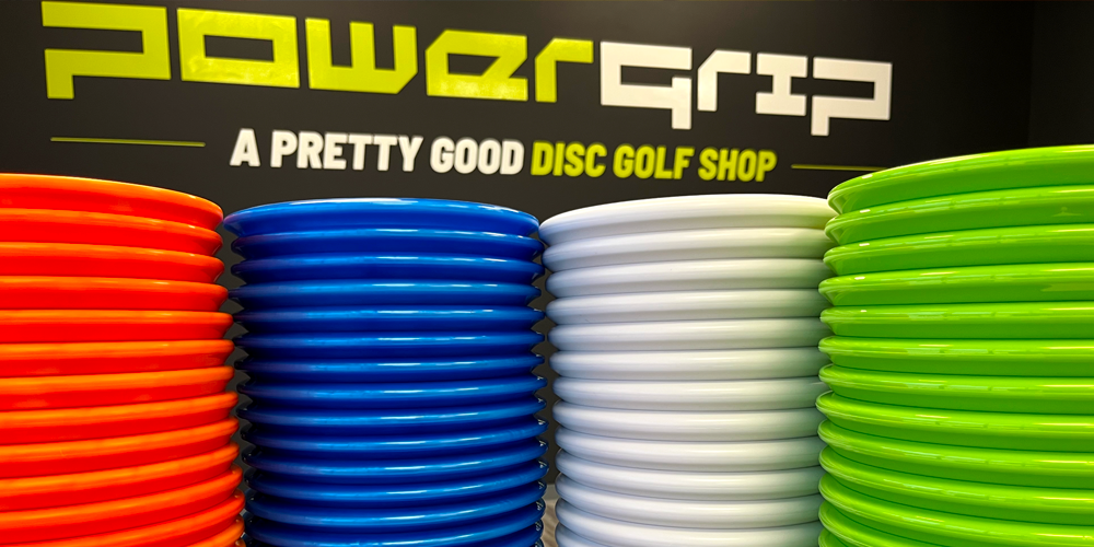 Stack of discs in front of Powergrip logo